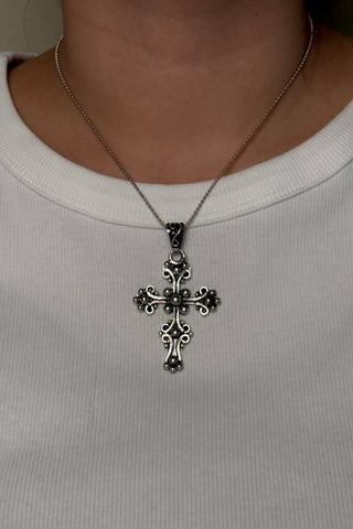 ornate cross pendant