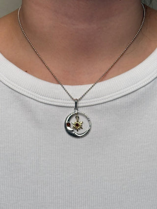 celestial moon with a dangling star pendant