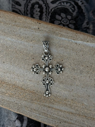 ornate cross pendant