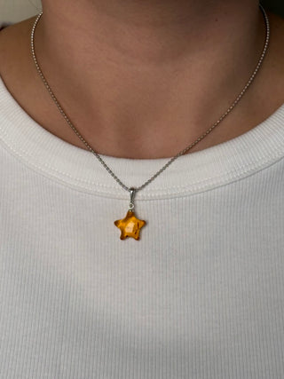 solid amber star pendant