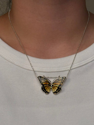 hand-carved amber butterfly pendant - Chula Co.