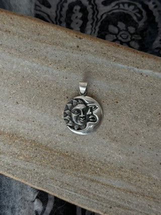 celestial moon and sun pendant