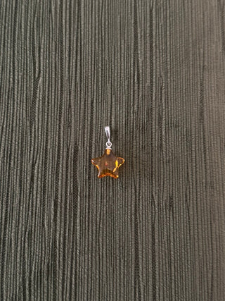 solid amber star pendant