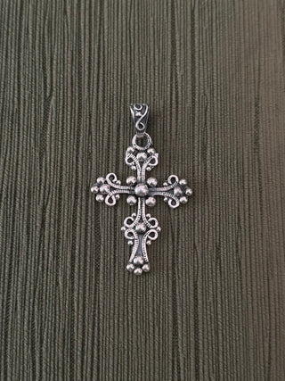 ornate cross pendant