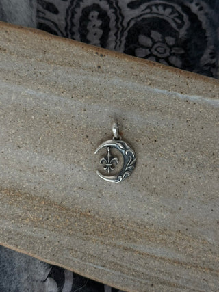 flourished fleur de lis pendant