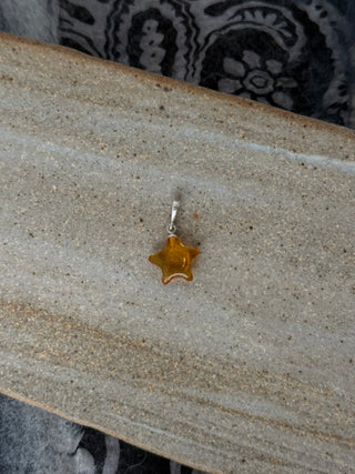 solid amber star pendant