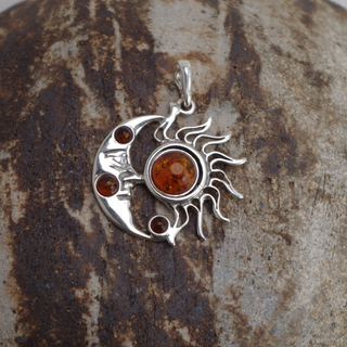 celestial moon and sun amber pendant